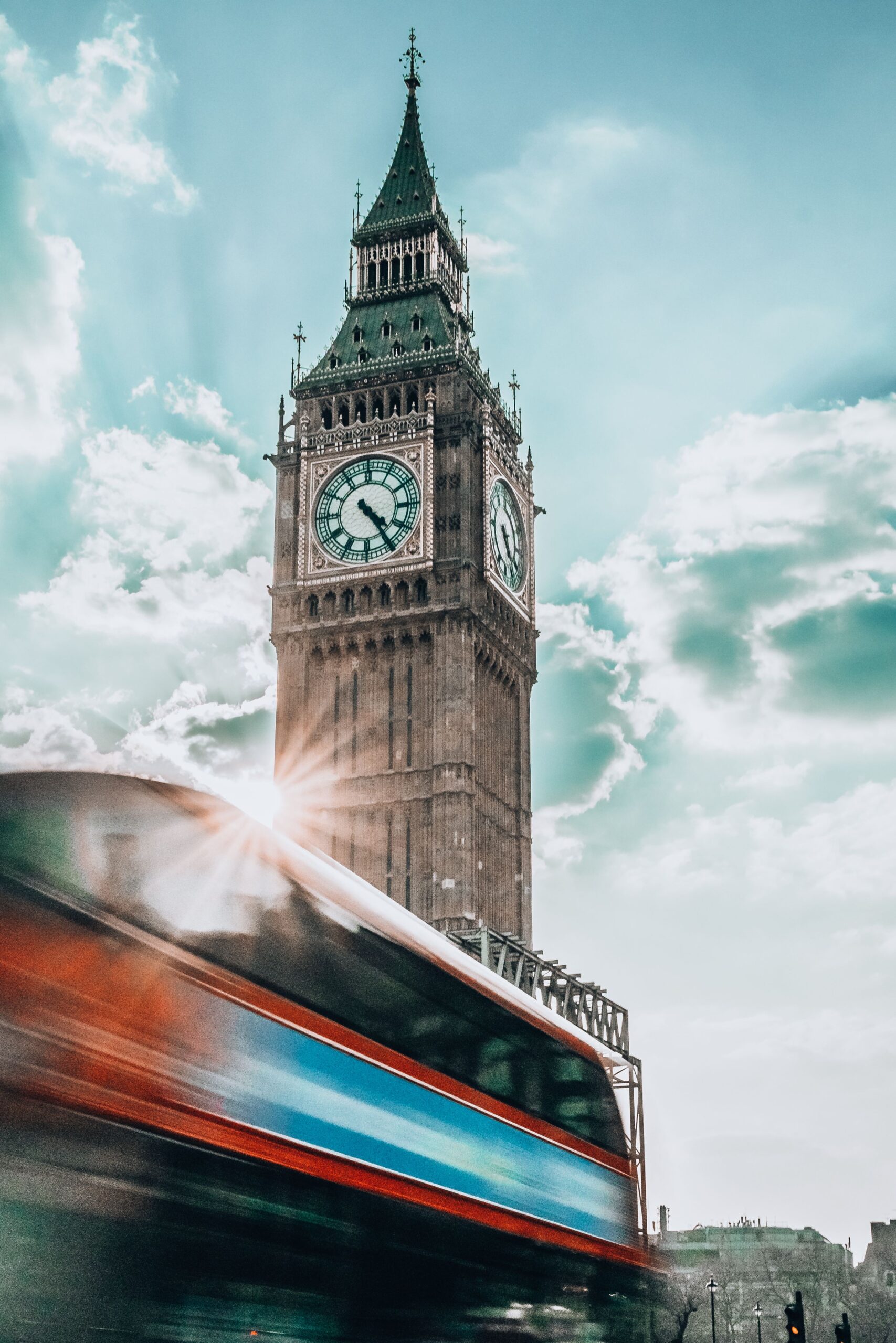 Big Ben with a red double-decker bus representing London removals coverage for Metrik Moves Ltd